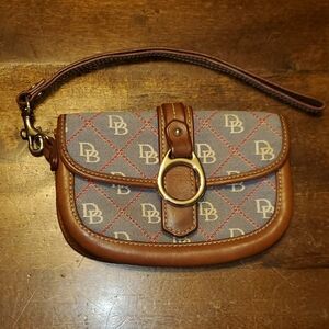 Dooney and bourke leather trim wristlet.